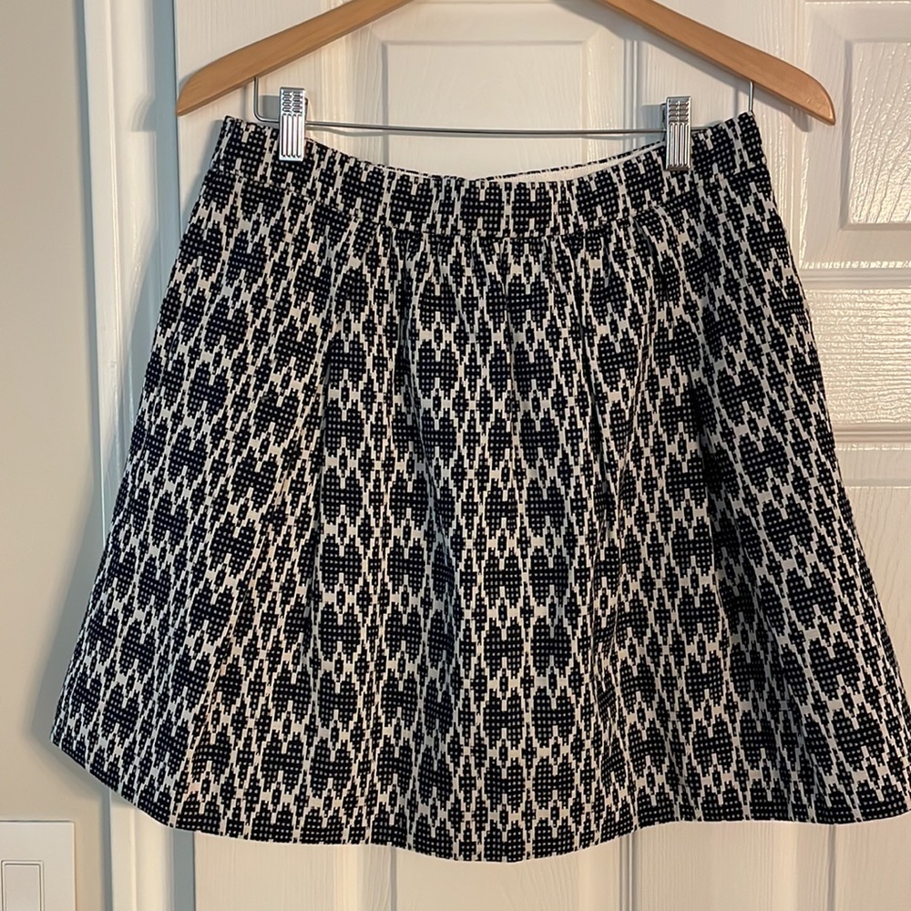 Navy pattered heavy cotton lined skirt with back zipper. Pockets!